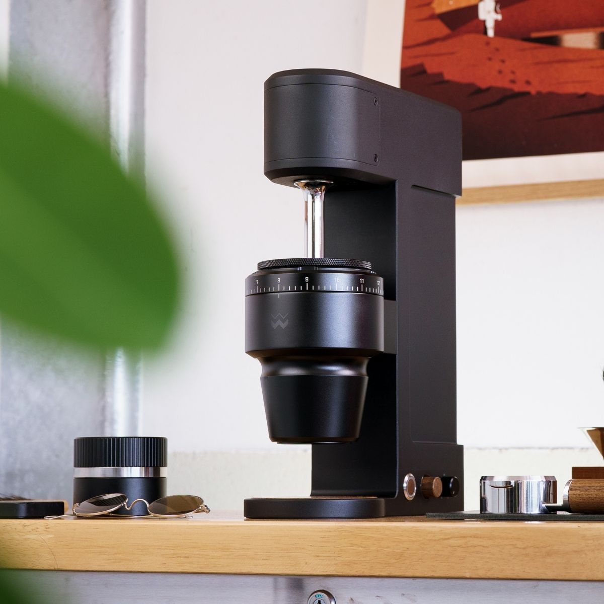 Weber Workshops Key specialty coffee grinder, matte black placed on ounter.