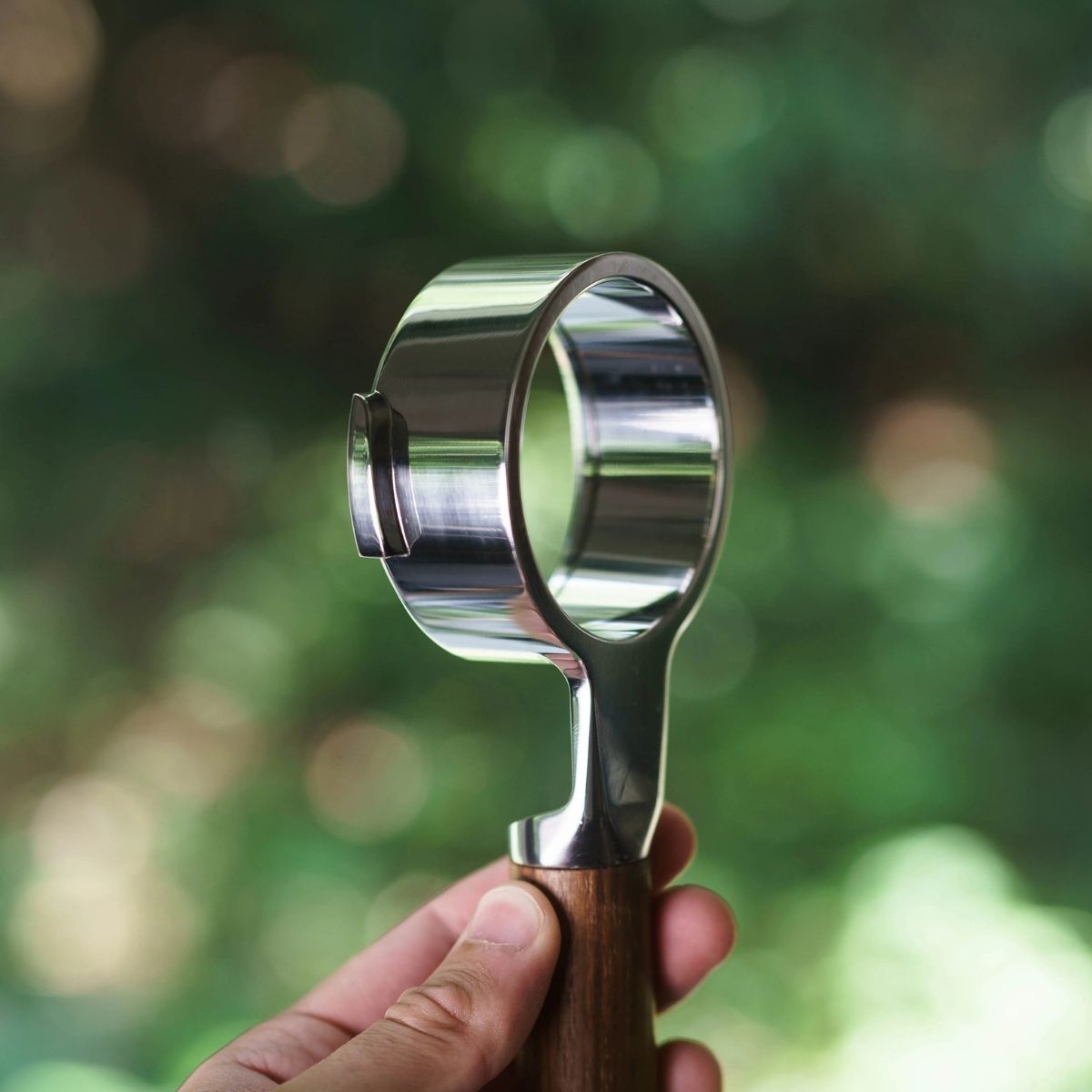 Buck portafilter Weber Workshops close-up showcasing its polished stainless steel and wooden handle.